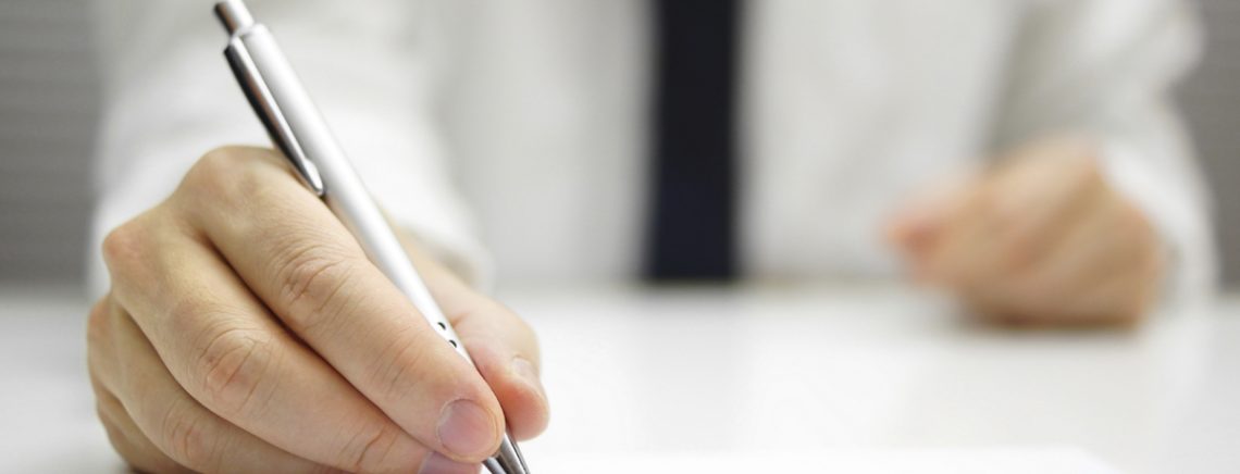 businessman is signing contract