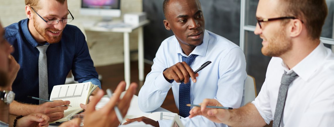 Multi-ethnic businessmen discussing new strategy of working