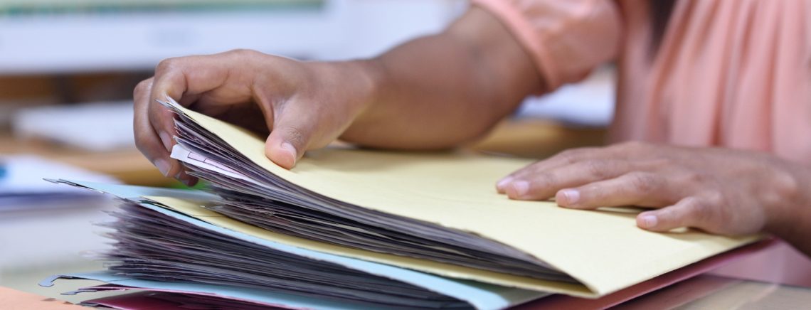 Female employees are handling the file.